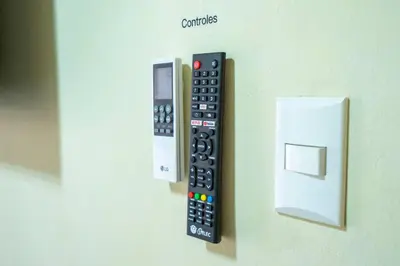 a remote control is attached to a wall at Luxury Sky Blue in Jarabacoa