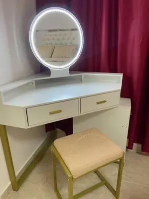 a white desk with a mirror and a stool at Nice and Breezy Apartment in Santiago de los Caballeros