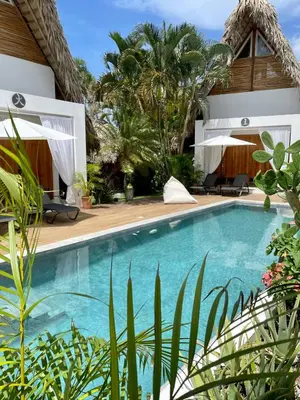 a swimming pool in the backyard of a villa at Leeloo Boutique Hotel in Las Terrenas