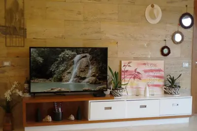 a flat screen tv sitting on top of a wooden wall at Villa loren A3 in Las Terrenas