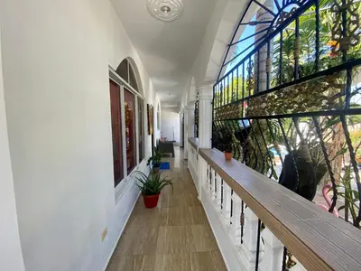 a hallway of a building with a stained glass window at Casa Tipo Villa, Piscina, Playas De RSJ a 4 min in Río San Juan