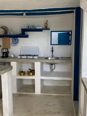a counter with a sink in a room at Blue Beach Eco-Hotel by Sanfabini in Bayahibe