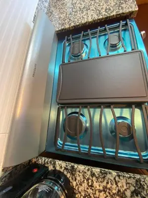 a close up of a stove with a camera at Luxury Penthouse Santo Domingo W in Santo Domingo