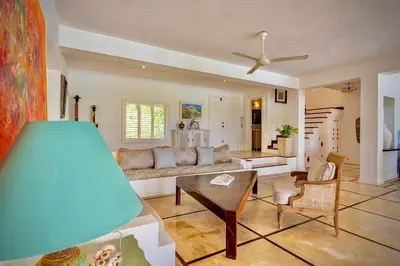 a living room with a couch and a table at Villa Azulsalado - Frente a la playa in Las Terrenas