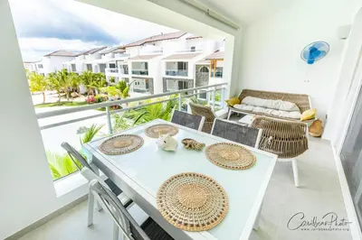 a white table and chairs on a balcony with a view at Syrma 302 Estrella Dominicus Apartment in La Laguna