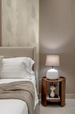 a bedroom with a bed and a table with a lamp at Elegant Seaside Villa Steps to Beach & Golf Course in Boca del Soco