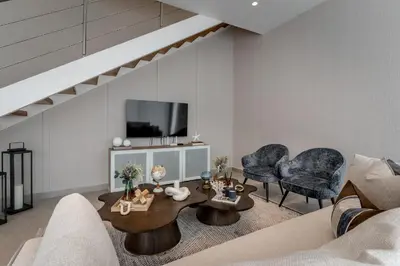 a living room with a couch and a table and chairs at Elegant Seaside Villa Steps to Beach & Golf Course in Boca del Soco