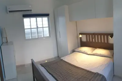 a bedroom with a bed and a window at CasaMia RD B&B in Río San Juan