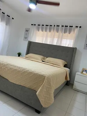 a bedroom with a large bed in a room at Cómodo y completo en el Cacique in Bella Vista