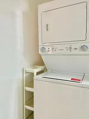 a kitchen with a white refrigerator and a microwave at Cómodo y completo en el Cacique in Bella Vista
