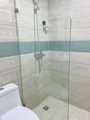 a shower with a glass door in a bathroom at Cómodo y completo en el Cacique in Bella Vista