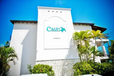 a white building with a sign on it at White Sands Punta Cana - Pool-Jacuzzi in Punta Cana