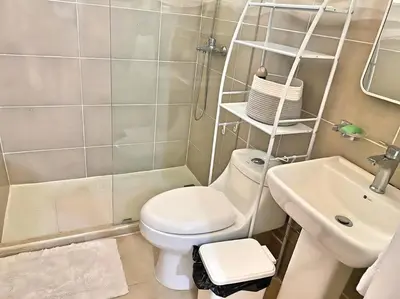 a small bathroom with a toilet and a sink at Apto 3 Habitaciones Zona Tranquila Con Parqueo in Concepción de La Vega