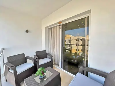 a living room with a couch and chairs and a balcony at Apto 3 Habitaciones Zona Tranquila Con Parqueo in Concepción de La Vega