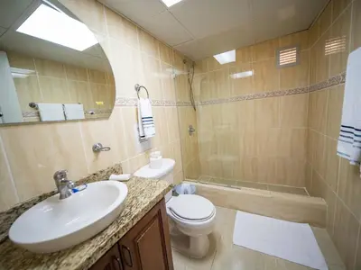 a bathroom with a sink and a toilet and a shower at Garden Condos Apt 30 - Lovely 1br Condo W Pool in Sosúa