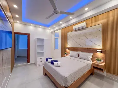 a bedroom with a bed and a ceiling fan at Plaza Achim 7, Luxury Apt 250m From Sosua Beach in Sosúa