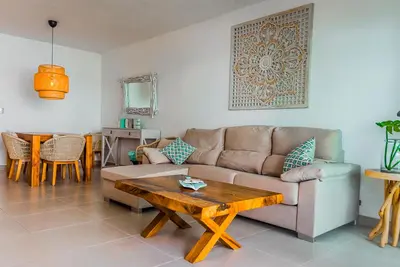 a living room with a couch and a table at Beach Homes Punta Cana in Punta Cana