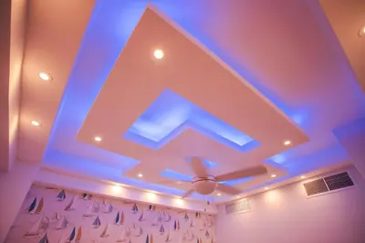 a room with a ceiling with blue lights at Xeliter Las Olas Juan Dolio in Guayacanes