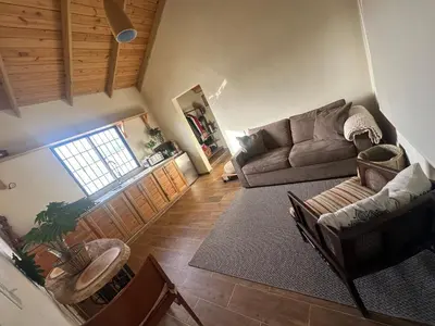 an overhead view of a living room with a couch at El ATiCO ConstanzaRD in Constanza