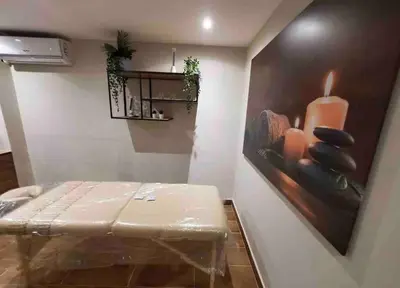 a room with a table and a painting on the wall at Brand New Luxury 1 BDR Pool-Cine - Saune-WIFI - I 19 in Santo Domingo