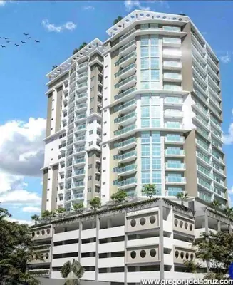 a tall white building with trees in front of it at RoyalSuite 1BDR-Poll-Gym-Saune-g17 in Santo Domingo