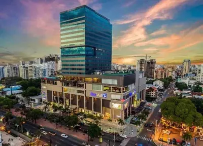 a tall building in a city with a lot of traffic at RoyalSuite 1BDR-Poll-Gym-Saune-g17 in Santo Domingo