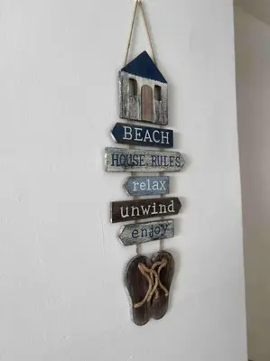 a sign for a beach house with a house rules and a house rules relay unwanted at Bueno Paradise Condo In Marbella in Juan Dolio