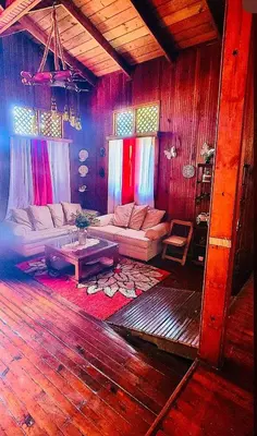 a living room with a couch and a table at Rancho Fernandez in Jarabacoa