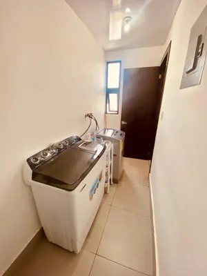 a kitchen with a stove and a sink in a room at Condo hotel rialto Recidences in Santiago de los Caballeros