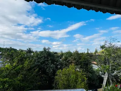 a view of a blue sky and some trees at Encantadora Terraza de Brisas Frescas in Jarabacoa