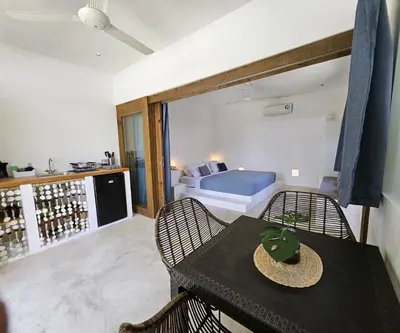 a room with a table and a bedroom with a bed at Soul Dream Bonita in Las Terrenas