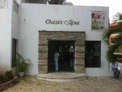 a man standing in the doorway of a casas spa at Celuisma Playa Dorada All Inclusive in Sampiño