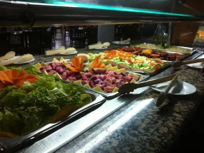 a buffet line with many different types of food at Celuisma Playa Dorada All Inclusive in Sampiño