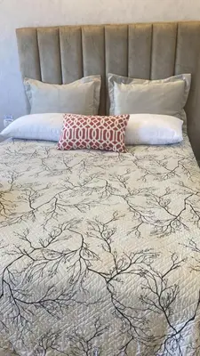 a bed with two pillows on top of it at Mar & Relax in Santo Domingo