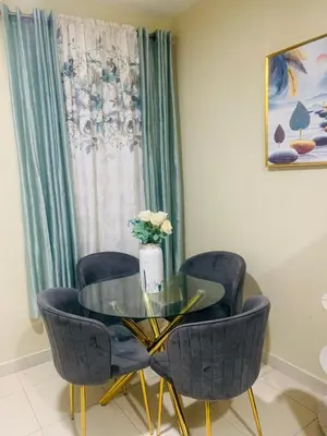 a dining room with a glass table and chairs at Apartamento Mariela 2 in San Felipe de Puerto Plata