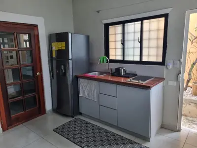 a kitchen with a sink and a refrigerator at Apartamento Estudio Puerto Plata in San Felipe de Puerto Plata