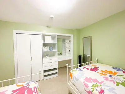 a bedroom with a bed and a dresser and a mirror at Marbella, Juan Dolio, Republica Dominicana in Juan Pedro