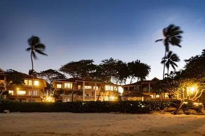 a resort at night with palm trees and buildings at Ocean front 2bdrm-2bath at Ocean Point 1 - Kitebeach Cabarete in Cabarete