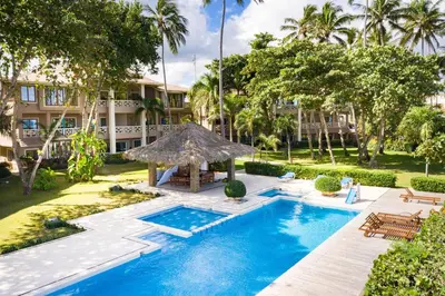 an outdoor swimming pool with a gazebo and a resort at Ocean front 2bdrm-2bath at Ocean Point 1 - Kitebeach Cabarete in Cabarete