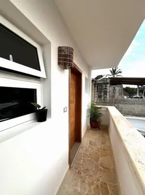 a hallway of a house with a television on the wall at Cozy Apartment in Las Galeras in Las Galeras