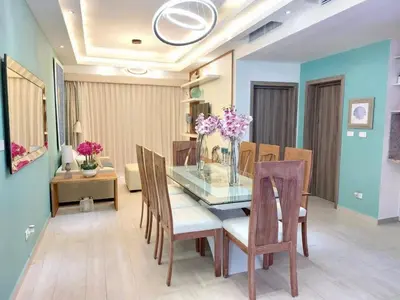 a dining room with a glass table and chairs at Luxury Gateaway Penthouse in front of Hard Rock in Punta Cana