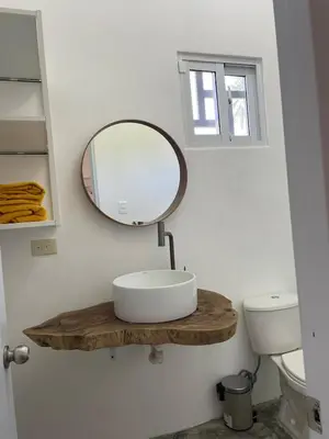 a bathroom with a sink and a mirror on the wall at Villa Mar En Dreams House - 4 Pax, 2 Min de La Playa in Las Galeras