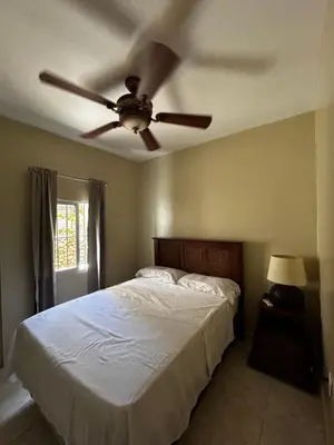 a bedroom with a bed with a ceiling fan at Casa Vista Mar, Los Patos, Barahona - 4x4 or All Terrain Vehicle to Access Property in Los Patos