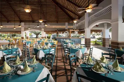 a banquet hall with blue tables and chairs at Select Sosua Adults Only, Trademark by Wyndham All Inclusive in Sosúa