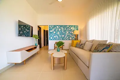 a living room with a couch and a table at Atlantic Paradise Cabrera in Arroyo Azul