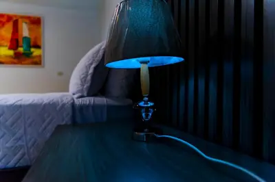 a blue lamp sitting on top of a table at El Colibri Hotel in Sosúa