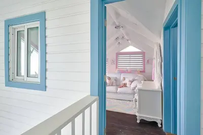 a childs room with a couch and a window at New-CasitaDeLasFlores-View-Wifi-Jacuzzi-Jarabacoa in Jarabacoa