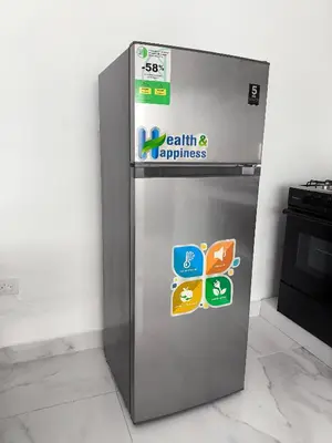 a refrigerator with stickers on the side of it at Apartahotel Señorial in Higuey