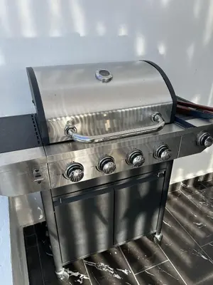 a stove top oven with a silver top at LEVEL suites #7 in Sosúa