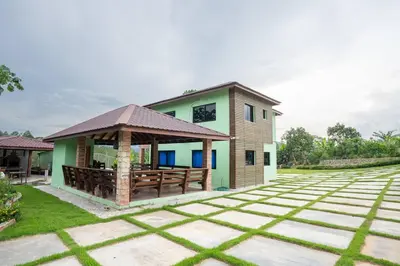a house with a gazebo in the yard at The American Dream in Jarabacoa